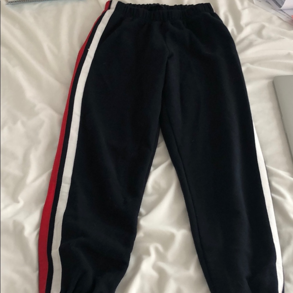 Navy joggers with red and white stripes